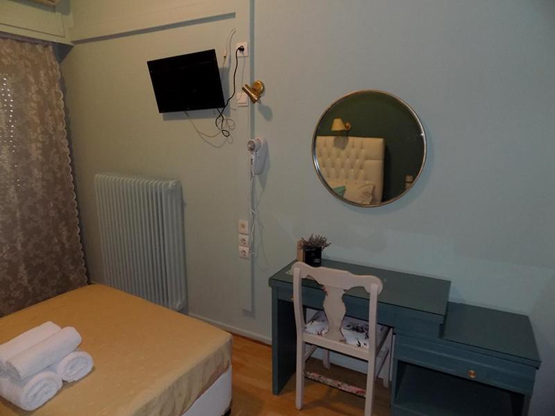 Postel nebo postele na pokoji v ubytování Hotel King Pyrros