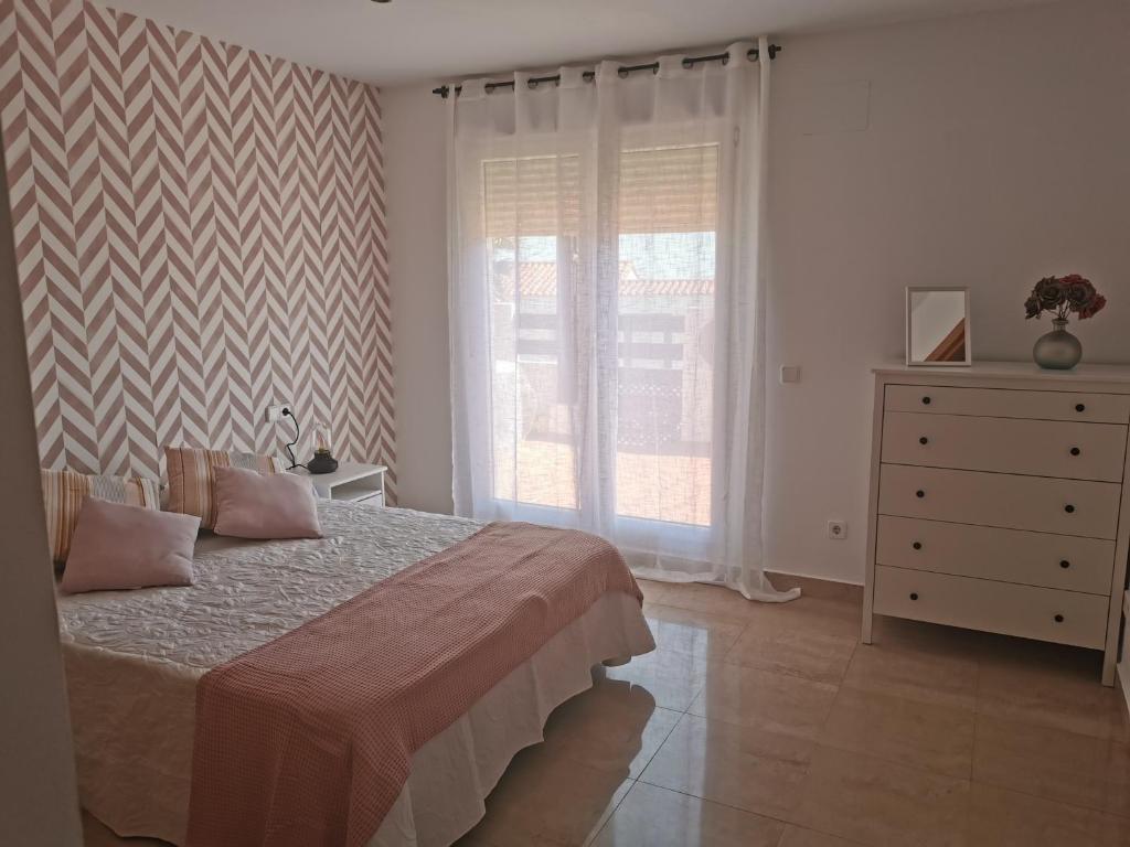 Postel nebo postele na pokoji v ubytování Manilva House