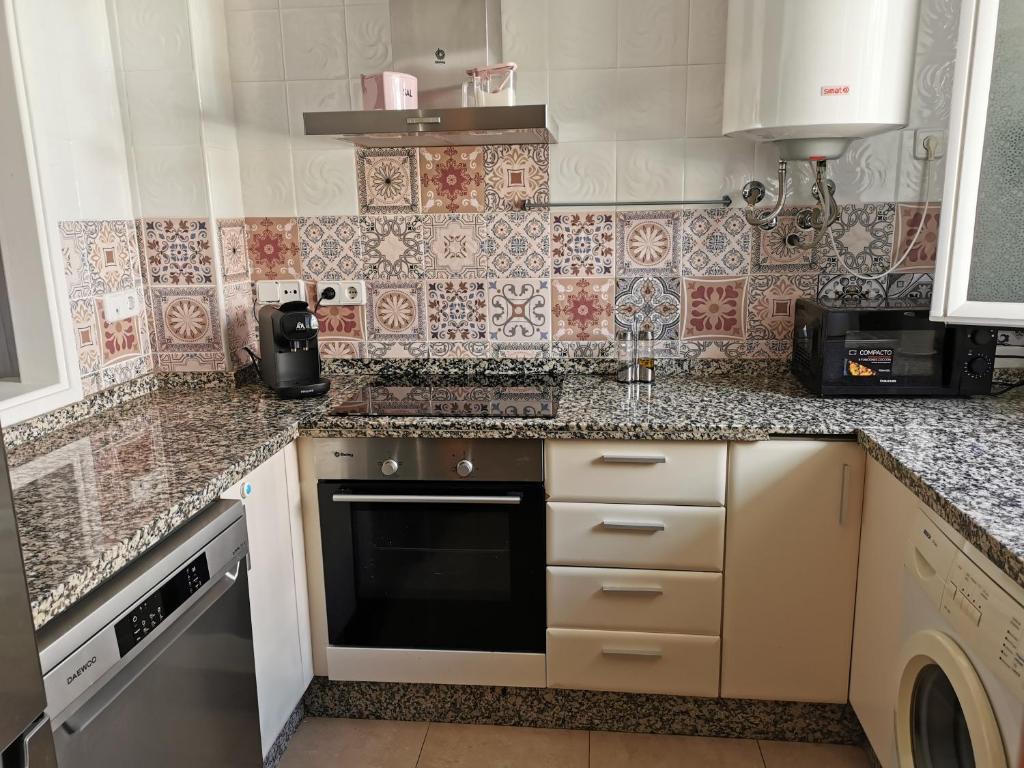 Kuchyň nebo kuchyňský kout v ubytování Manilva House