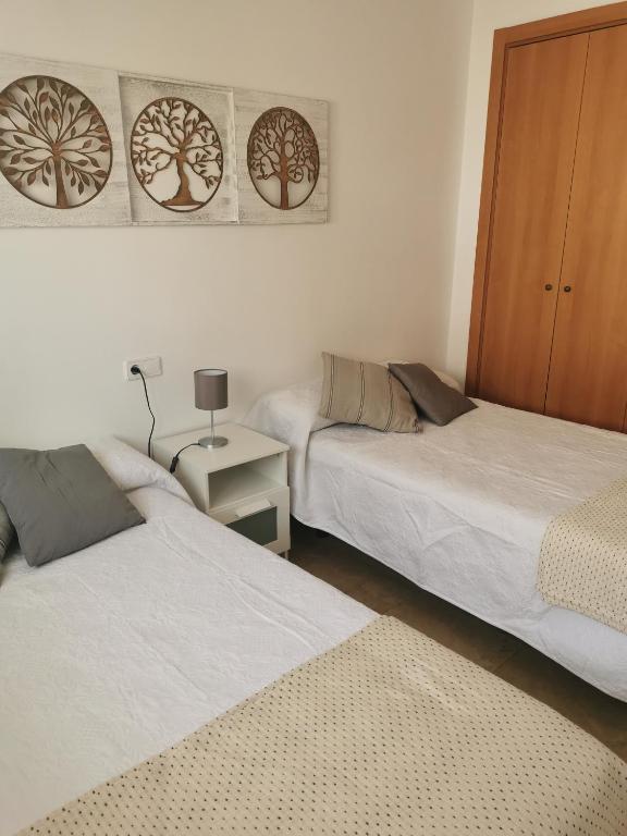 Postel nebo postele na pokoji v ubytování Manilva House