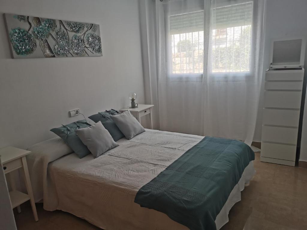 Postel nebo postele na pokoji v ubytování Manilva House