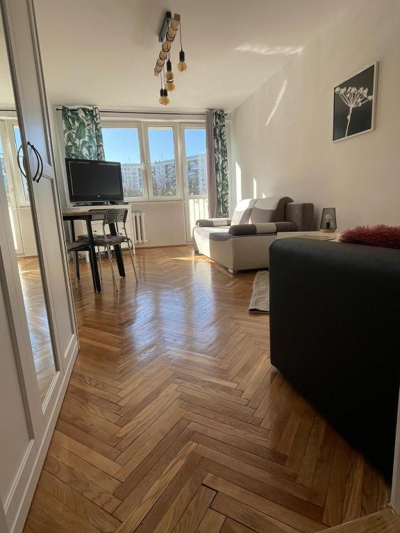 Televízia a/alebo spoločenská miestnosť v ubytovaní Carmen Apartments4u - Pomorska 82