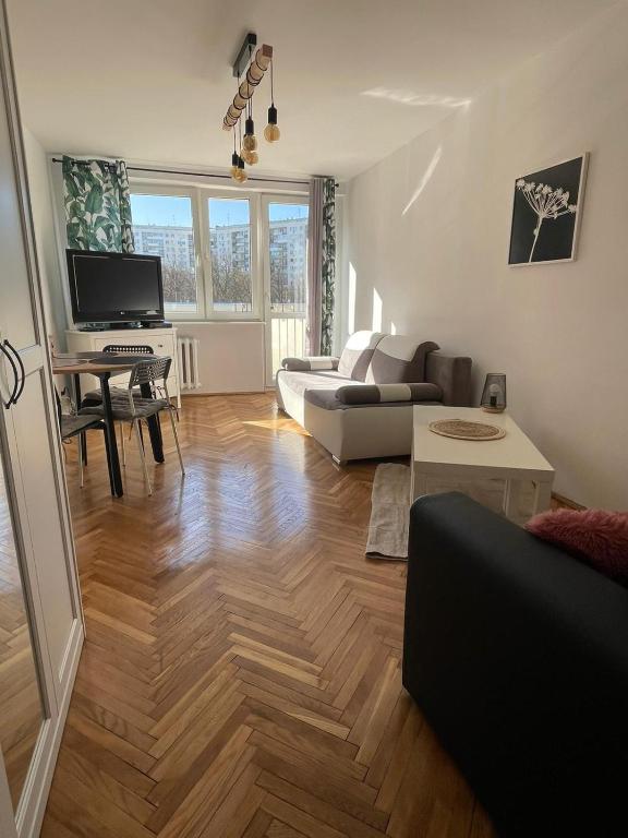 Televízia a/alebo spoločenská miestnosť v ubytovaní Carmen Apartments4u - Pomorska 82