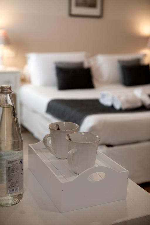 Postel nebo postele na pokoji v ubytování Hotel Broletto - Centro Storico