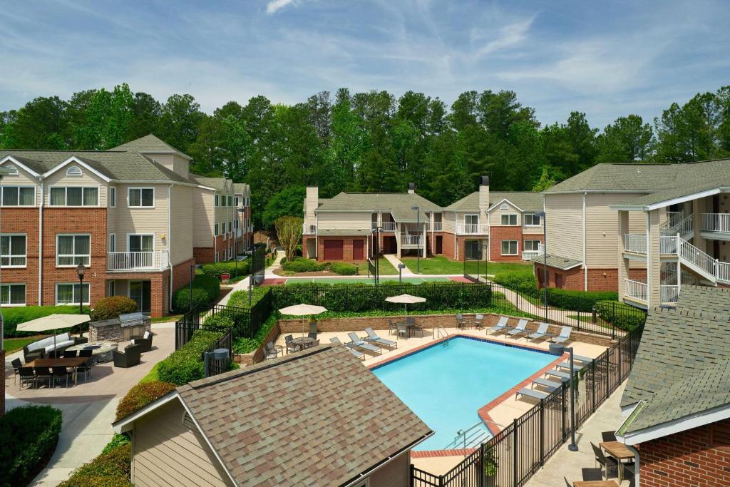 an aerial view of a apartment complex with a swimming pool at Sonesta ES Suites Atlanta Alpharetta Windward in Alpharetta