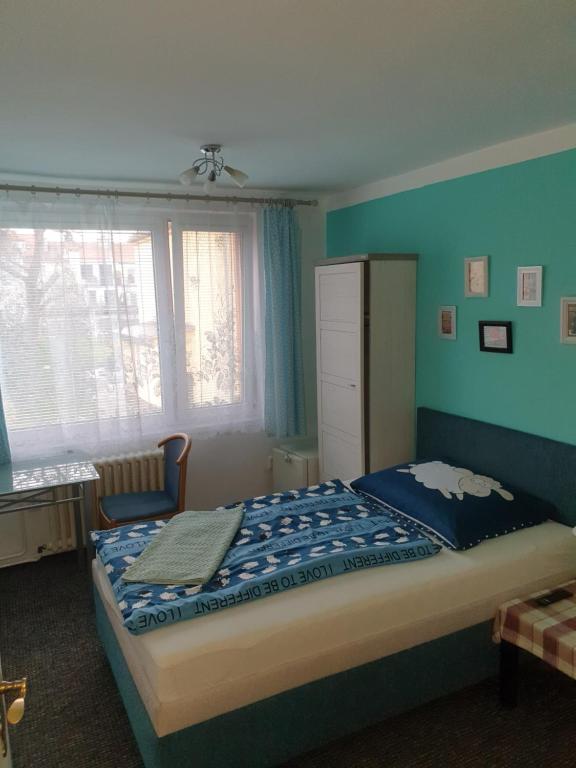 Postel nebo postele na pokoji v ubytování Pension Beránek