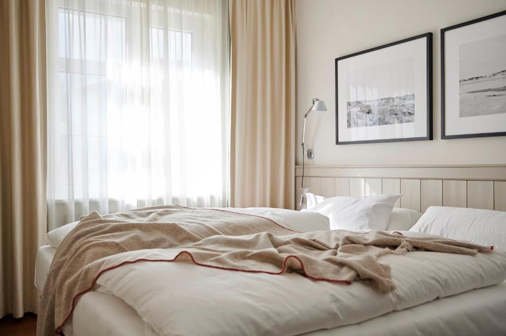 Postel nebo postele na pokoji v ubytování Hotel Haus am Meer