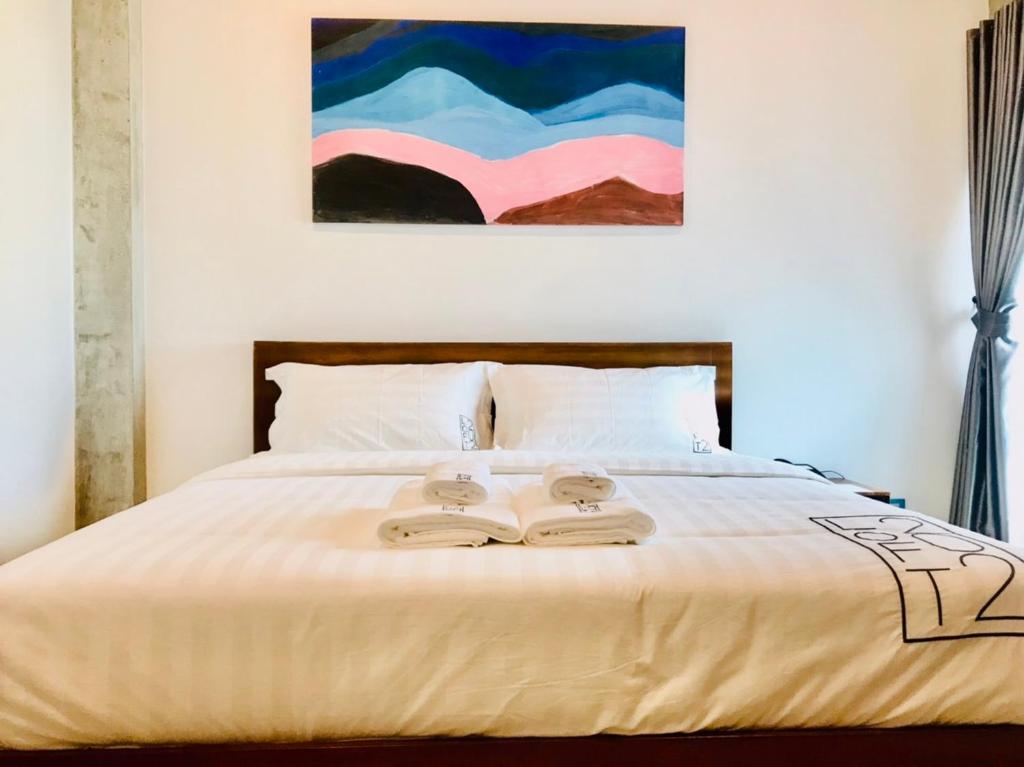 Postel nebo postele na pokoji v ubytování Loft 202 Hotel