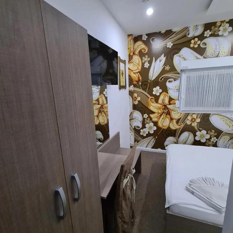 Postel nebo postele na pokoji v ubytování Garni Hotel & Spa Nicolo