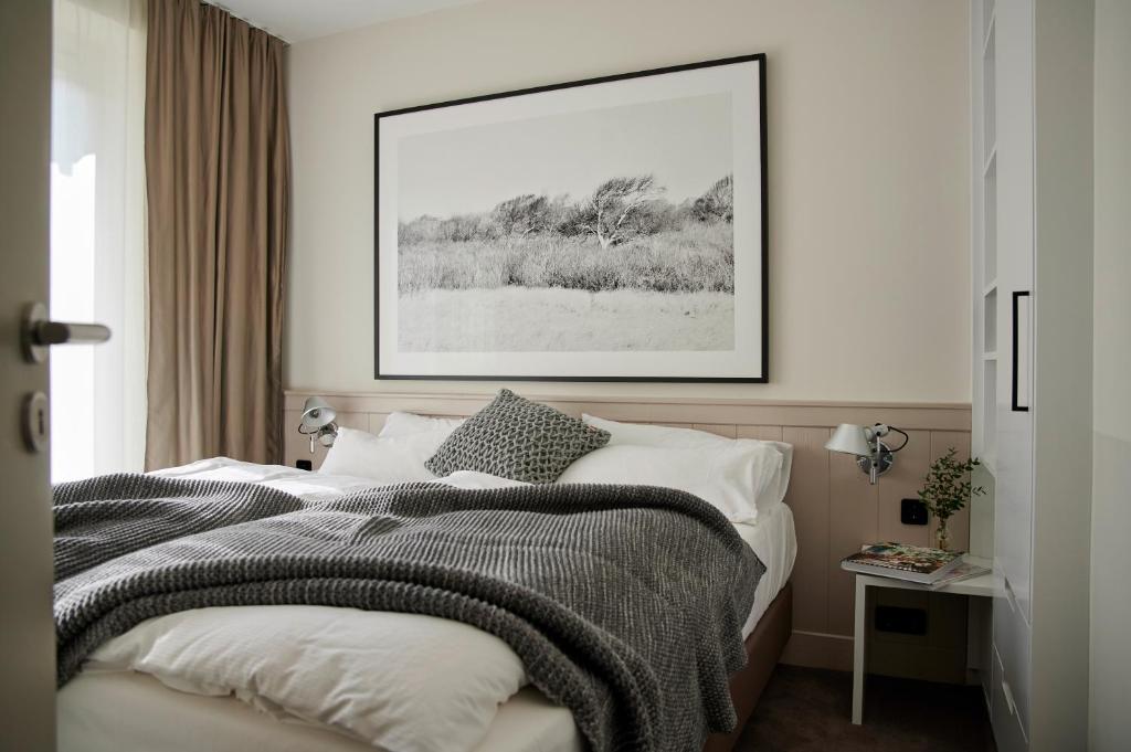Postel nebo postele na pokoji v ubytování Hotel Haus am Meer