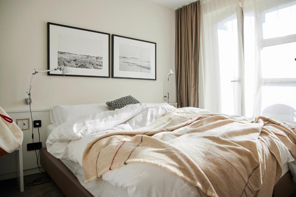 Postel nebo postele na pokoji v ubytování Hotel Haus am Meer