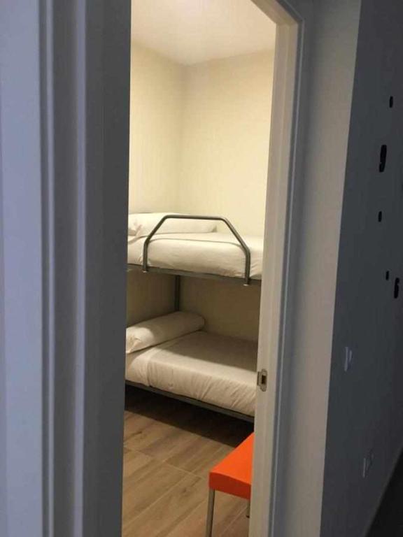 Postel nebo postele na pokoji v ubytování KubiK APARTAMENTOS K2
