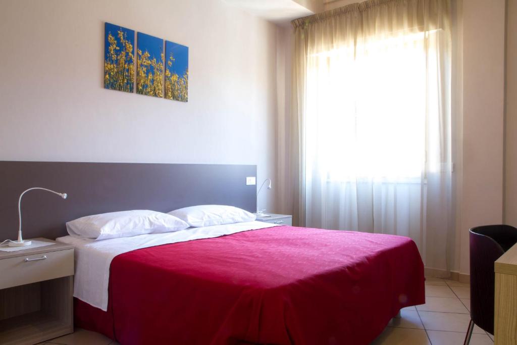 Postel nebo postele na pokoji v ubytování Il Fiore in una Stanza