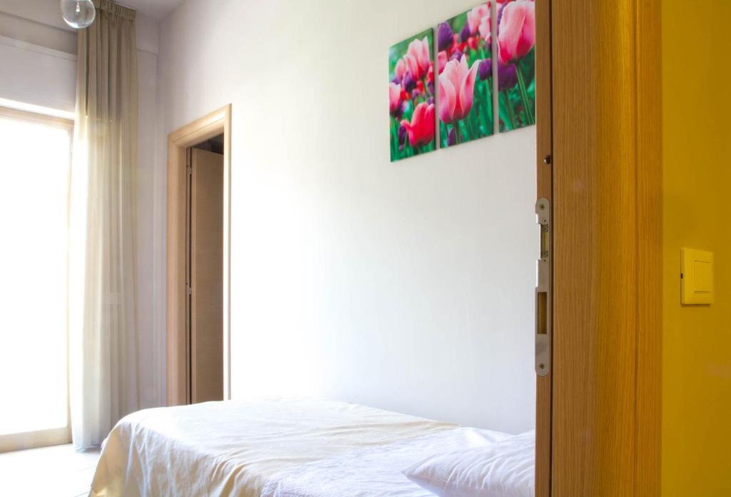 Postel nebo postele na pokoji v ubytování Il Fiore in una Stanza