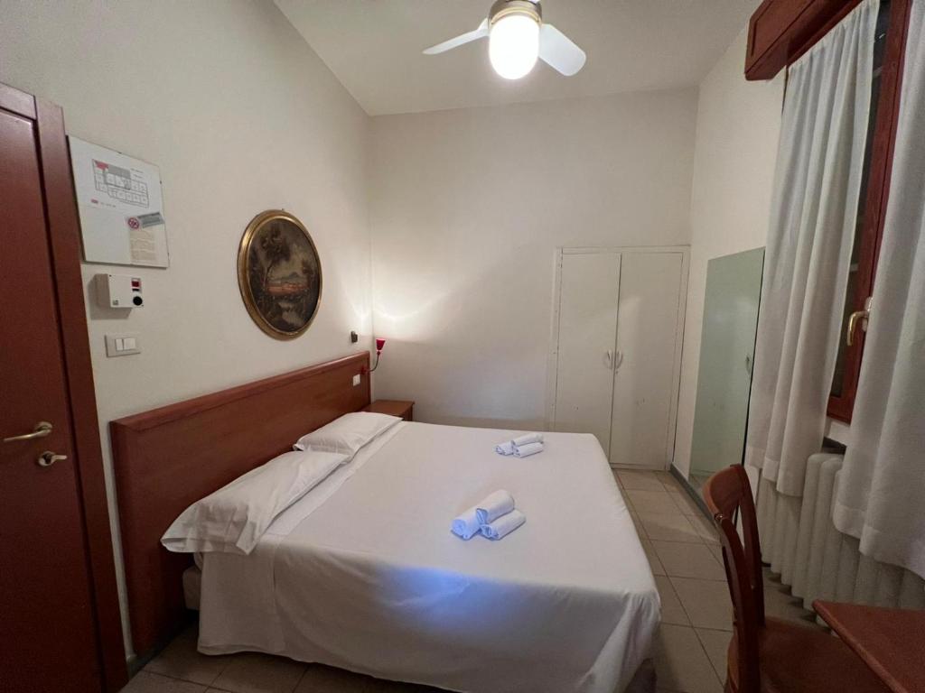 Postel nebo postele na pokoji v ubytování Hotel Adriatico