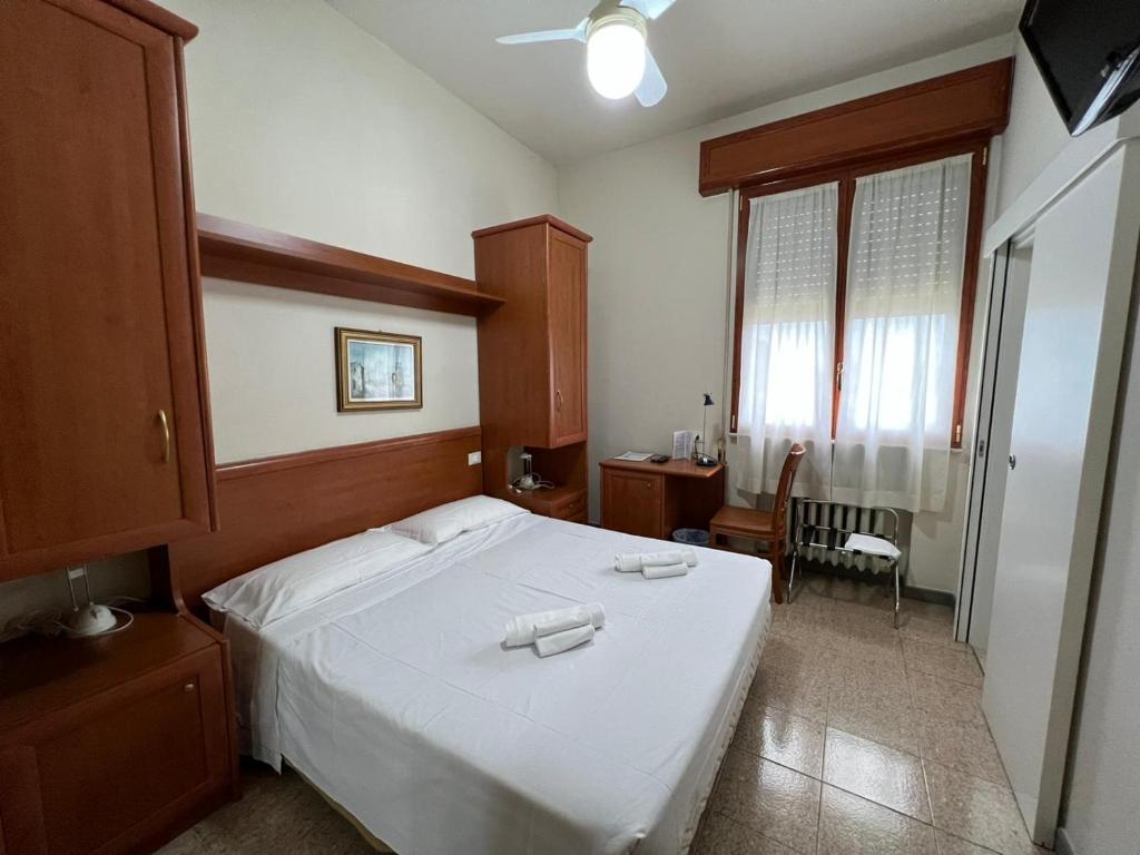 Postel nebo postele na pokoji v ubytování Hotel Adriatico