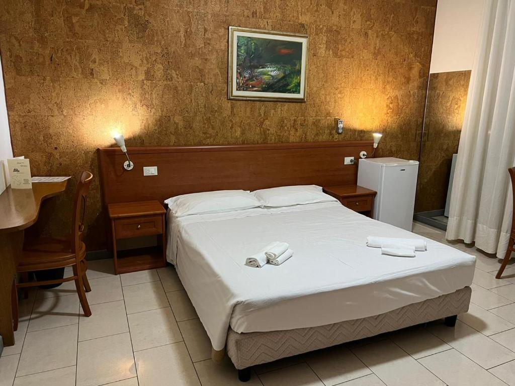 Postel nebo postele na pokoji v ubytování Hotel Adriatico