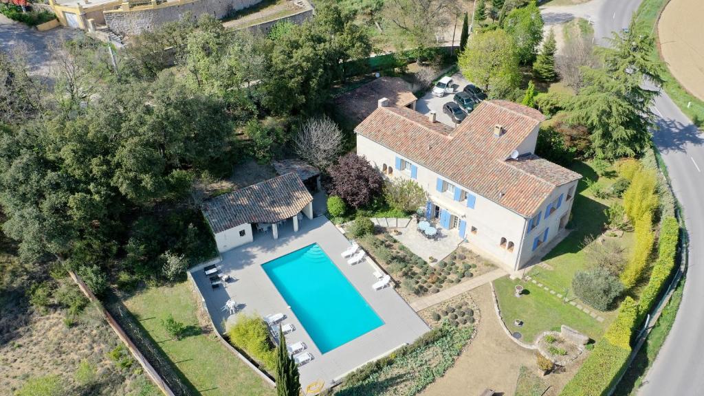an overhead view of a house with a swimming pool at Bastide du Bonheur Saint Donat in Gréoux-les-Bains
