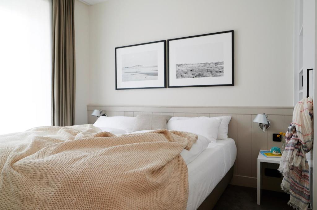 Postel nebo postele na pokoji v ubytování Hotel Haus am Meer