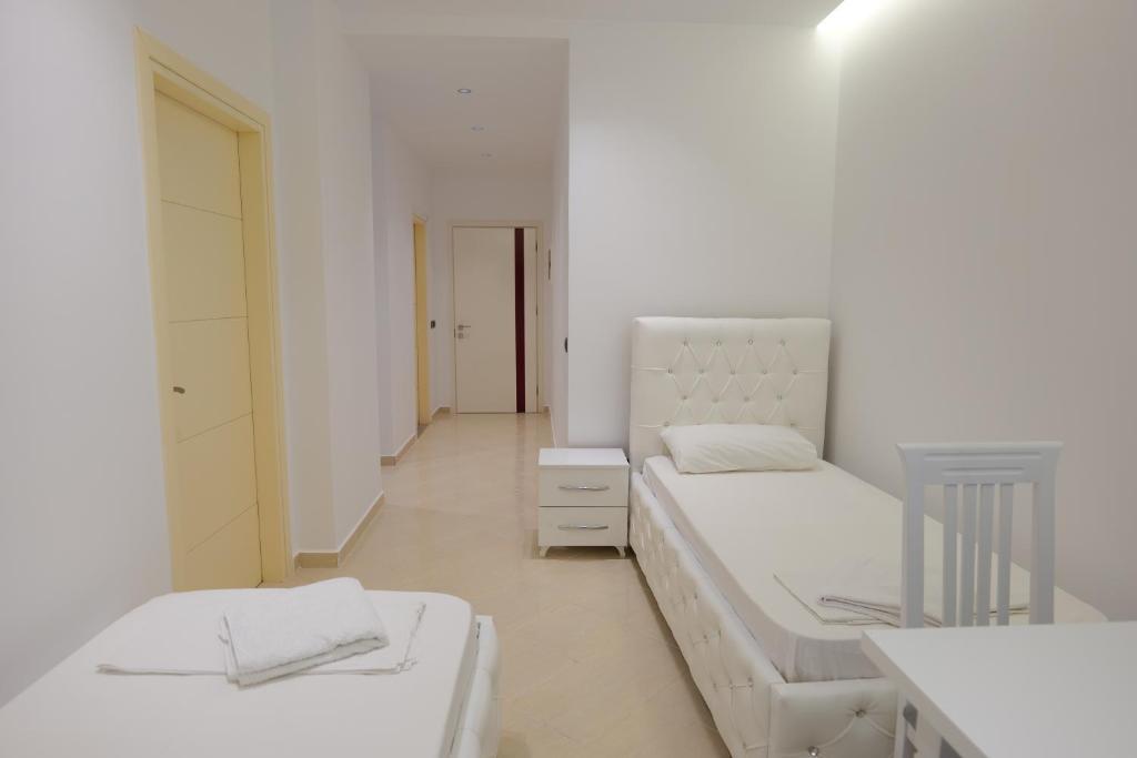 Postel nebo postele na pokoji v ubytování Hotel Dior
