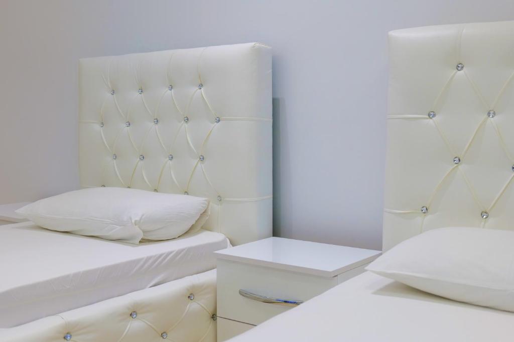 Postel nebo postele na pokoji v ubytování Hotel Dior