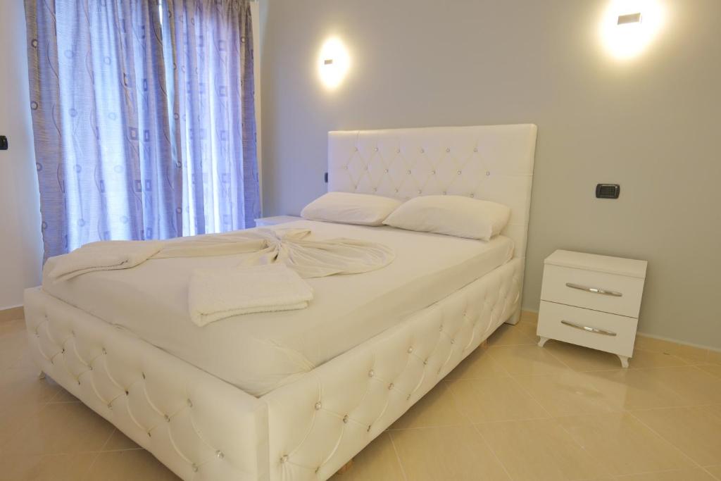 Postel nebo postele na pokoji v ubytování Hotel Dior