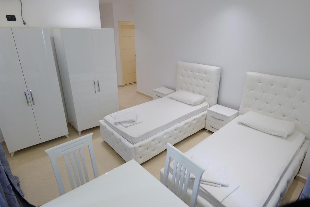 Postel nebo postele na pokoji v ubytování Hotel Dior