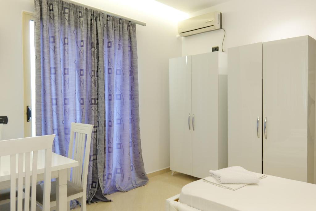 Postel nebo postele na pokoji v ubytování Hotel Dior