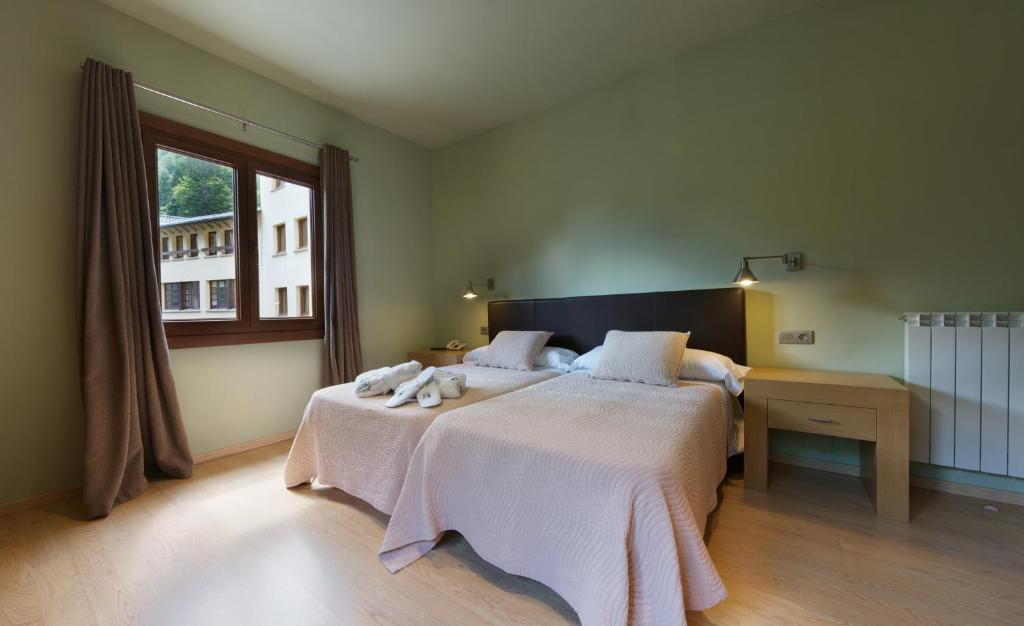 Postel nebo postele na pokoji v ubytování Hotel Manantial