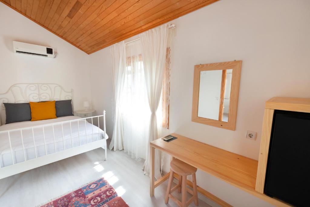 Postel nebo postele na pokoji v ubytování Lukkies Lodge Cirali