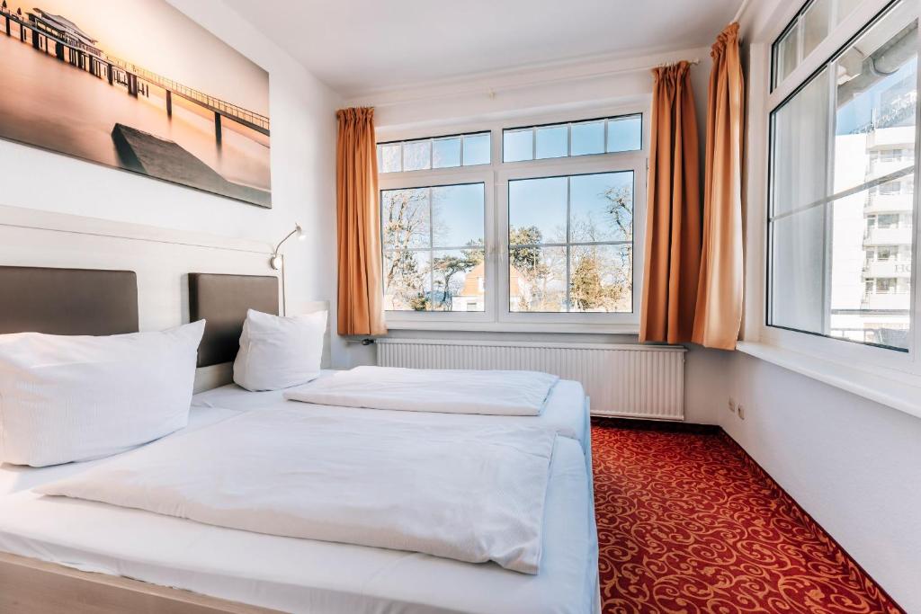 Postel nebo postele na pokoji v ubytování Hotel Gorch Fock