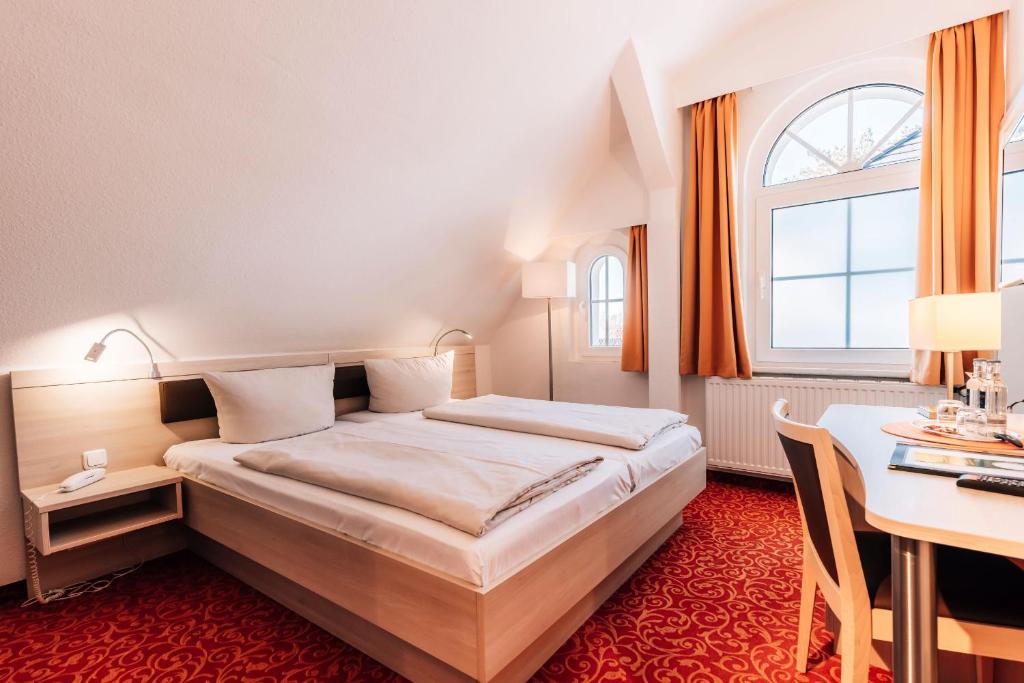 Postel nebo postele na pokoji v ubytování Hotel Gorch Fock