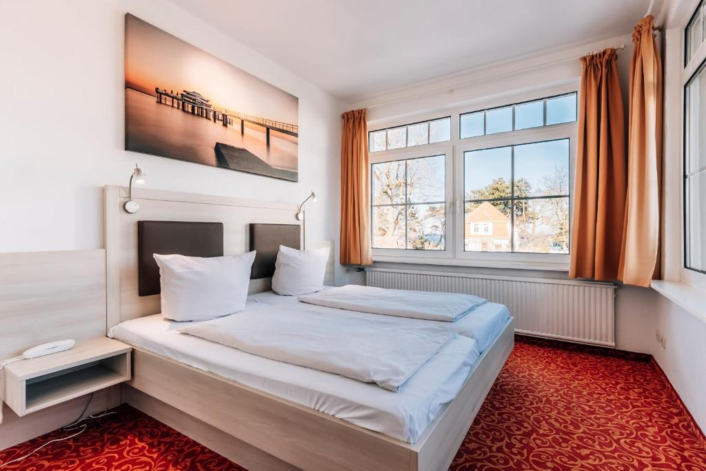 Postel nebo postele na pokoji v ubytování Hotel Gorch Fock