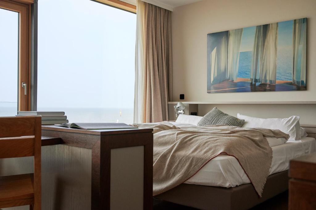 Postel nebo postele na pokoji v ubytování Hotel Haus am Meer