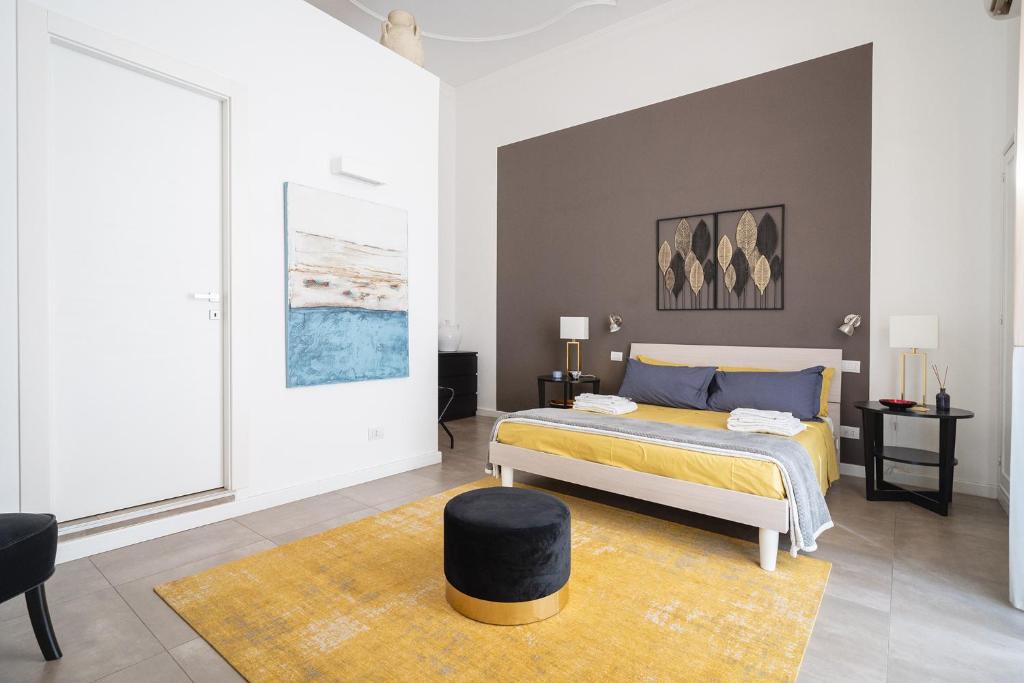 Łóżko lub łóżka w pokoju w obiekcie Fourooms - Bari Sparano