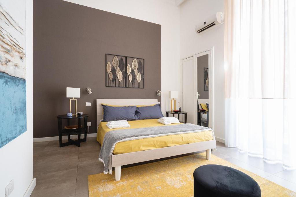 Łóżko lub łóżka w pokoju w obiekcie Fourooms - Bari Sparano
