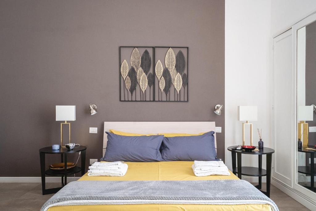 Łóżko lub łóżka w pokoju w obiekcie Fourooms - Bari Sparano