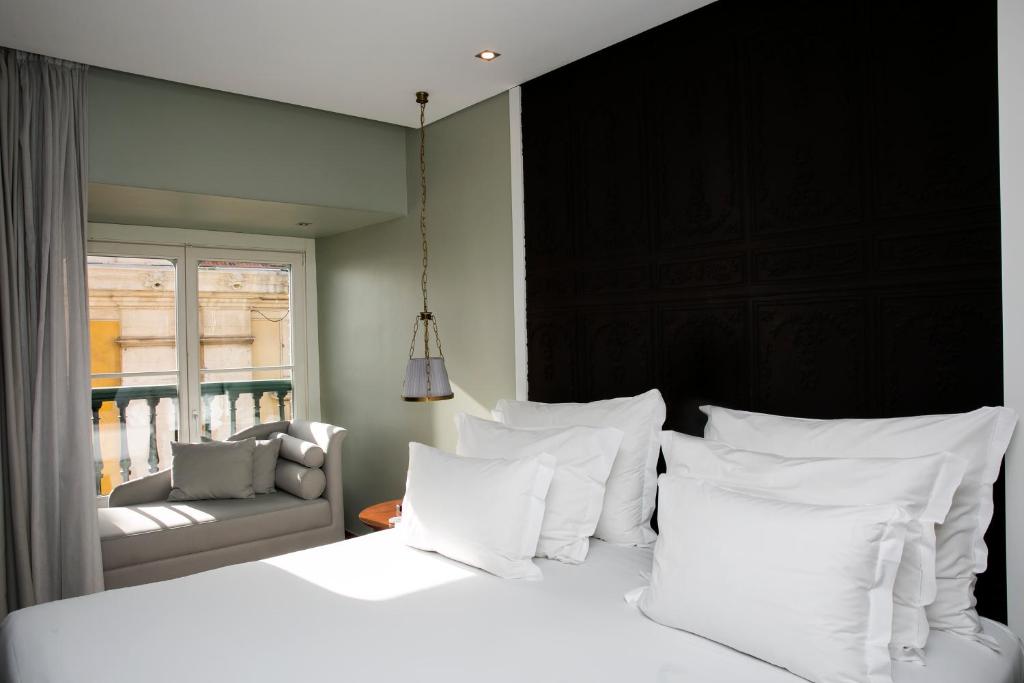 Postel nebo postele na pokoji v ubytování Pousada de Lisboa - Small Luxury Hotels Of The World