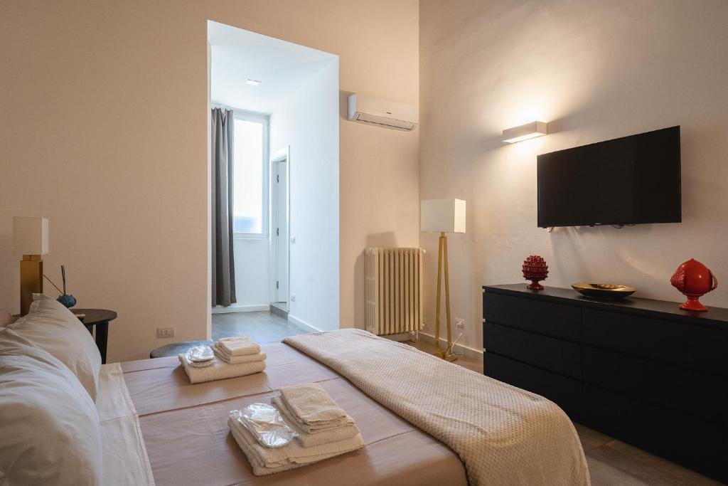 Łóżko lub łóżka w pokoju w obiekcie Fourooms - Bari Sparano