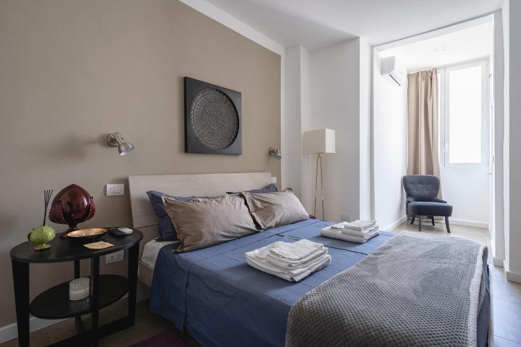 Łóżko lub łóżka w pokoju w obiekcie Fourooms - Bari Sparano