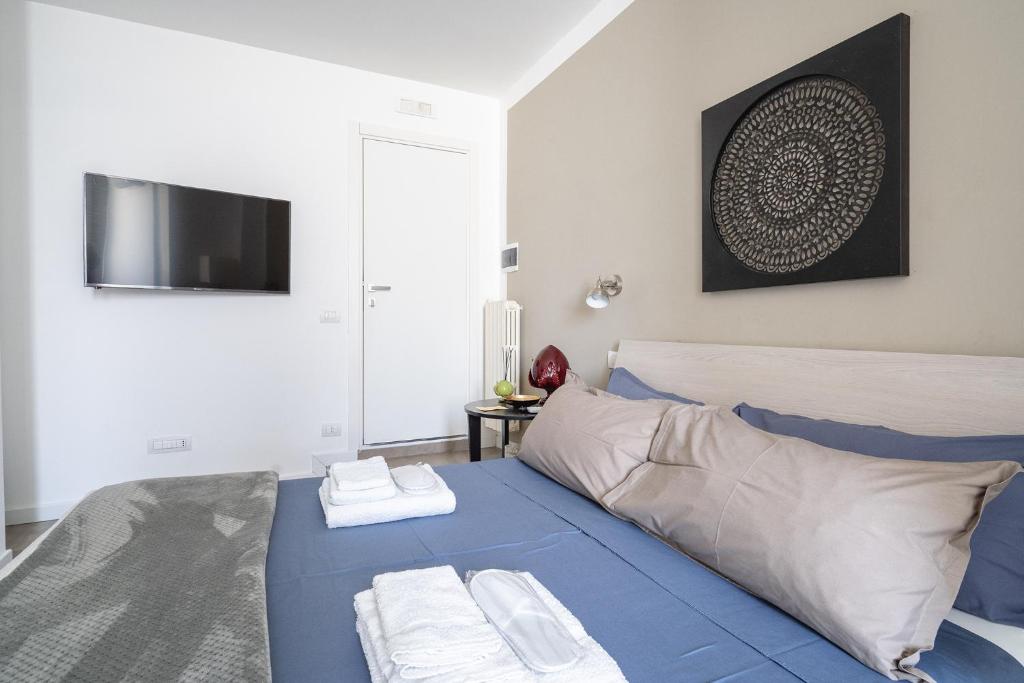 Łóżko lub łóżka w pokoju w obiekcie Fourooms - Bari Sparano