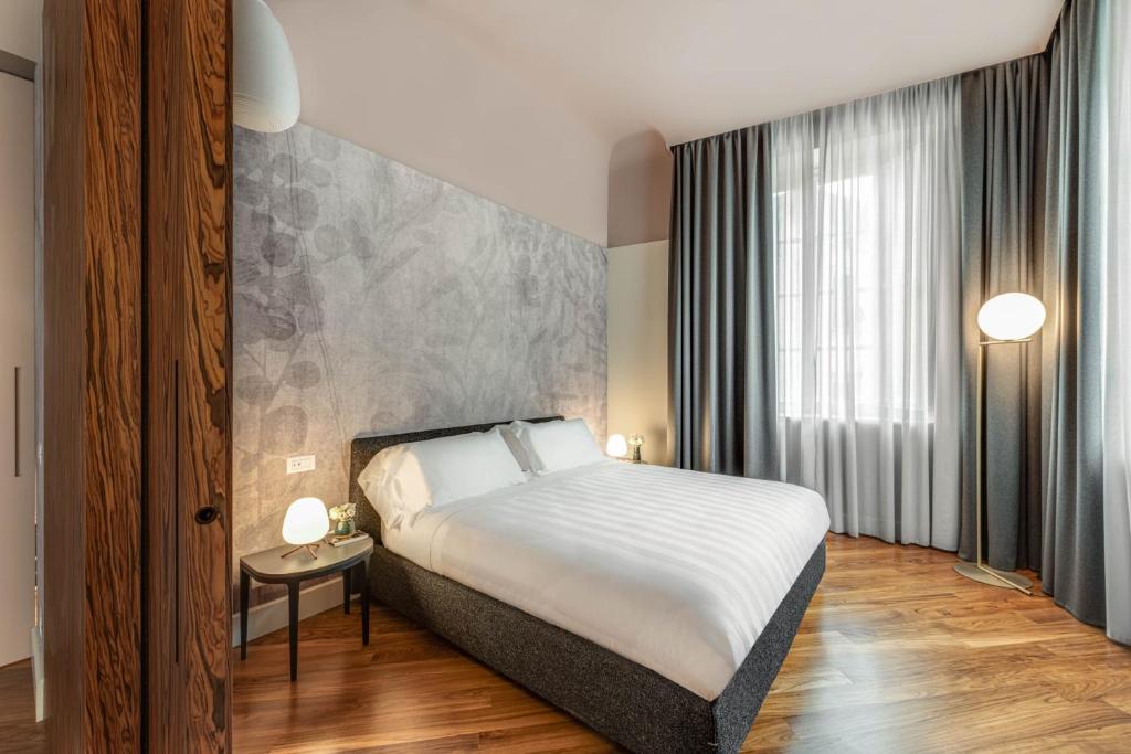 Postel nebo postele na pokoji v ubytování Palazzo Dipinto