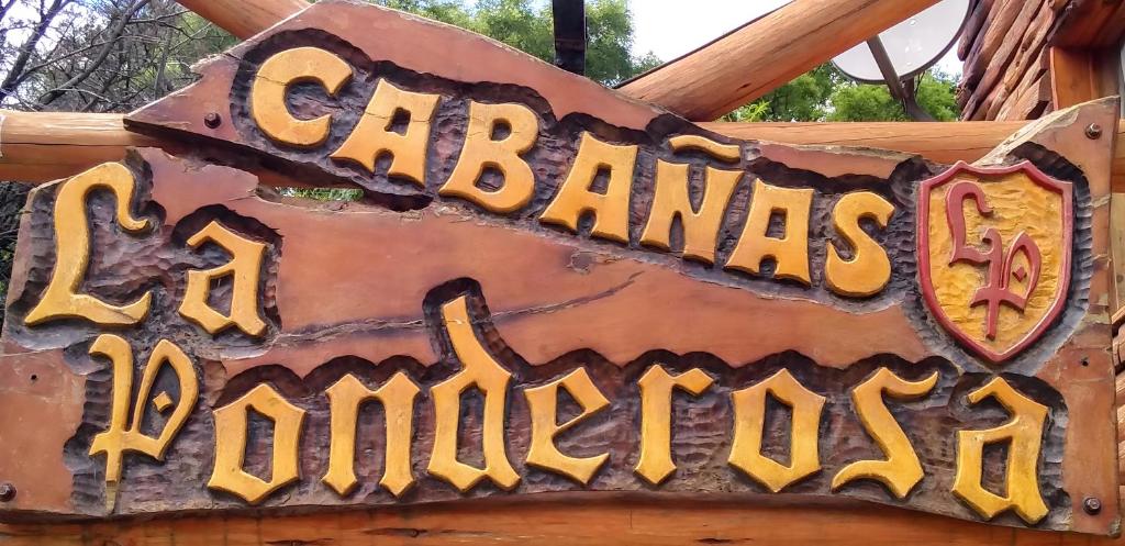 a sign that reads carabases no longer haunted at Cabañas La Ponderosa in Villa Ventana