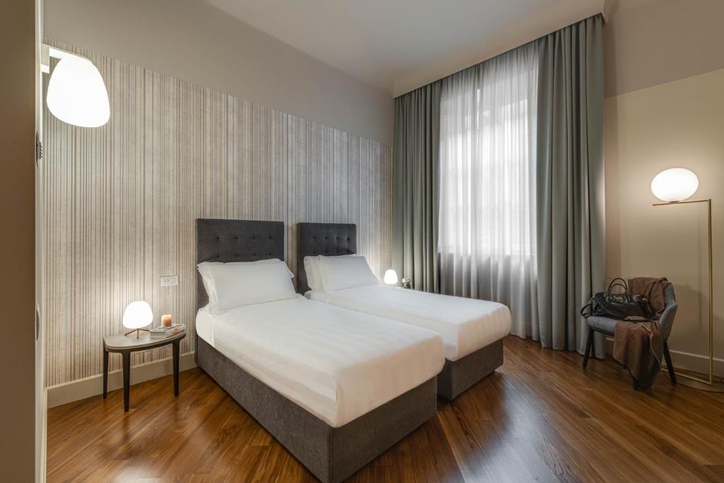 Postel nebo postele na pokoji v ubytování Palazzo Dipinto