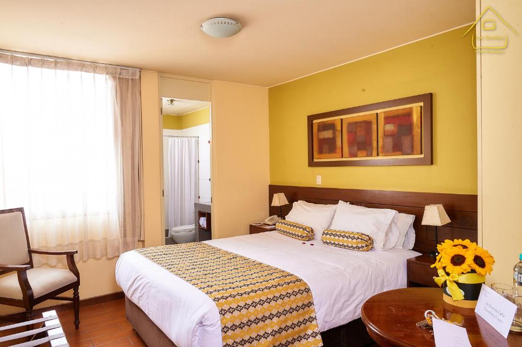 Postel nebo postele na pokoji v ubytování Hotel Los Tambos Boutique