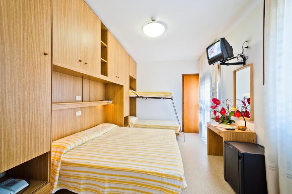 Postel nebo postele na pokoji v ubytování Hotel Bianchi