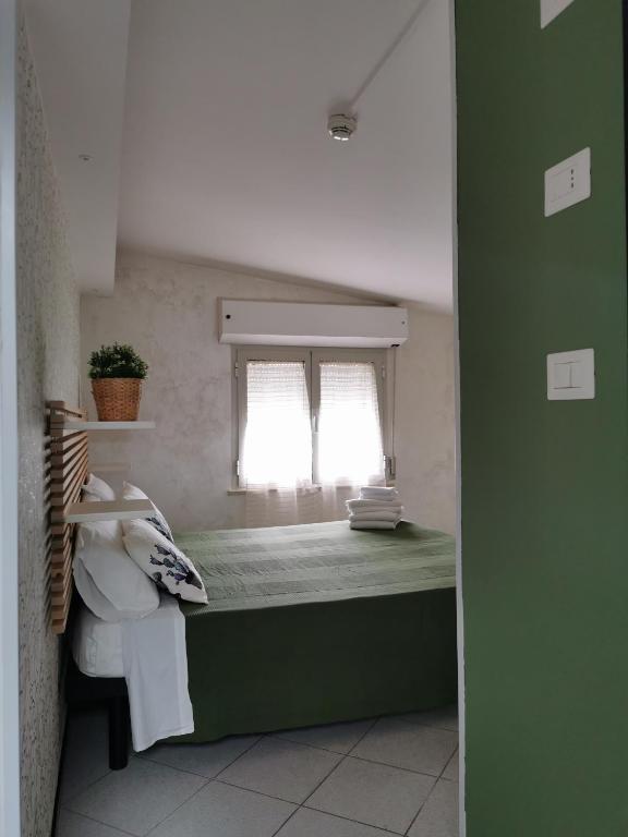 Postel nebo postele na pokoji v ubytování Hotel La Nidiola