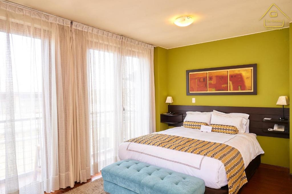 Postel nebo postele na pokoji v ubytování Hotel Los Tambos Boutique