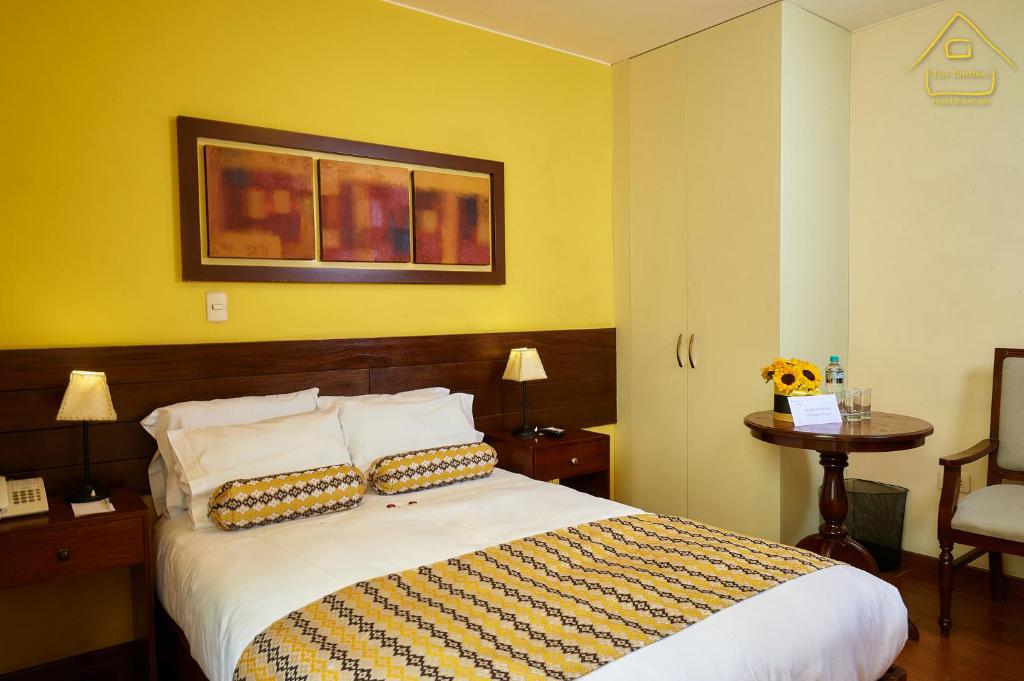Postel nebo postele na pokoji v ubytování Hotel Los Tambos Boutique