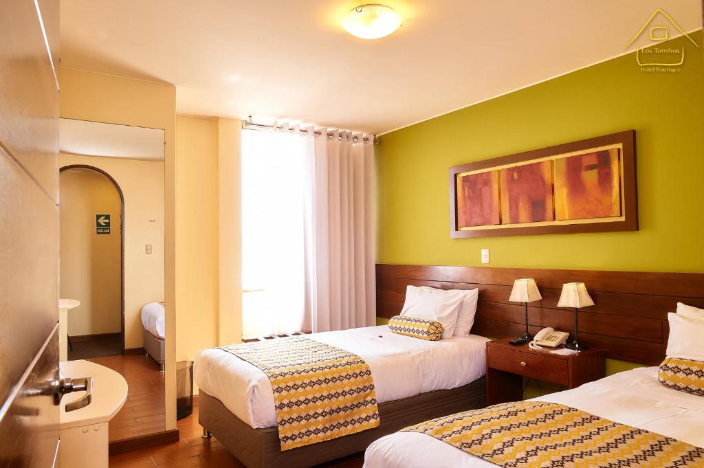 Postel nebo postele na pokoji v ubytování Hotel Los Tambos Boutique